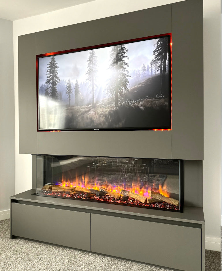 Modern electric fireplace with TV above it displaying a nature scene.